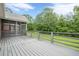 Enjoy the back deck overlooking the yard with gray wood flooring and scenic views, perfect for outdoor gatherings at 516 Main St, Hiram, GA 30141
