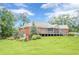 Lovely brick home with a screened in porch and lush green lawn at 516 Main St, Hiram, GA 30141