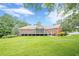 Gorgeous brick home featuring a screened-in porch and a beautifully landscaped yard at 516 Main St, Hiram, GA 30141