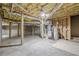 Unfinished basement space with exposed ceiling and concrete floor ready for customization at 516 Main St, Hiram, GA 30141