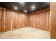 Cozy basement featuring carpeted floor, wood paneled walls and recessed lights at 516 Main St, Hiram, GA 30141