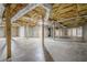 Unfinished basement featuring concrete floor, wood beams and ready for renovation at 516 Main St, Hiram, GA 30141