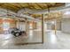 Unfinished basement includes exposed ceilings, cement floors, and a side entry garage at 516 Main St, Hiram, GA 30141