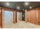 Basement with cedar closets, wood paneling, and carpet at 516 Main St, Hiram, GA 30141