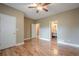 Spacious bedroom featuring hardwood floors, neutral paint, and generous closet space at 516 Main St, Hiram, GA 30141
