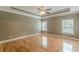 Bedroom with hardwood floors, crown molding, recessed lighting, and plentiful natural light at 516 Main St, Hiram, GA 30141