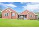 Charming single-story brick home with a manicured front lawn and a welcoming porch at 516 Main St, Hiram, GA 30141