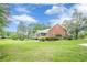 Stunning brick home with screened in porch and a manicured lush green lawn at 516 Main St, Hiram, GA 30141