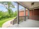 Cozy front porch with gray painted floors, porch swing and a view of the landscaped yard at 516 Main St, Hiram, GA 30141