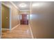 Elegant hallway with wood floors, white trim, and a view of the front door at 516 Main St, Hiram, GA 30141