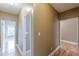 Hallway featuring hardwood flooring and neutral paint, creating a bright and open space at 516 Main St, Hiram, GA 30141