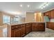 Kitchen island featuring lots of storage space and an open connection to the living room at 516 Main St, Hiram, GA 30141