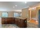 Kitchen island with granite counters and custom cabinets and access to living room at 516 Main St, Hiram, GA 30141