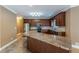 Gourmet kitchen featuring granite countertops, stainless appliances, and custom cabinets at 516 Main St, Hiram, GA 30141