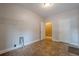 Spacious laundry room with tile floor, closet, and access to other rooms at 516 Main St, Hiram, GA 30141