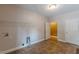 Well-lit laundry room features tile flooring, washer/dryer hookups and overhead shelving at 516 Main St, Hiram, GA 30141
