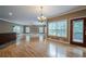 Expansive living room with hardwood floors, chandelier, and natural light at 516 Main St, Hiram, GA 30141