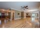 Spacious living room featuring hardwood floors, crown molding, and open access to the kitchen at 516 Main St, Hiram, GA 30141