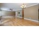 Living room with hardwood floors, ceiling fan, and television hookups at 516 Main St, Hiram, GA 30141
