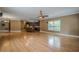 Open concept living room connecting to a kitchen and featuring hardwood floors at 516 Main St, Hiram, GA 30141