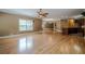 Expansive living room connects to kitchen with hardwood floors and natural light at 516 Main St, Hiram, GA 30141
