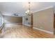 Bright and airy living room featuring hardwood floors, elegant lighting, and a comfortable atmosphere at 516 Main St, Hiram, GA 30141