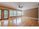Bright living room features hardwood floors, large windows, and french doors at 516 Main St, Hiram, GA 30141