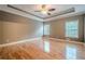 Spacious main bedroom with hardwood floors, tray ceiling, and bright natural light at 516 Main St, Hiram, GA 30141
