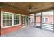 Screened-in porch featuring a ceiling fan and access to the backyard at 516 Main St, Hiram, GA 30141
