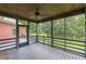 Screened in porch with wood ceiling and view of the trees at 516 Main St, Hiram, GA 30141
