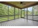 The screened porch offers outdoor living with green views at 516 Main St, Hiram, GA 30141