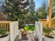 Backyard stairs leading down to a lush lawn and mature trees, creating a serene oasis at 582 Lakeshore Ne Dr, Atlanta, GA 30307