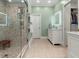 A stylish bathroom with shower, soaking tub, custom vanity, closet access and modern fixtures at 582 Lakeshore Ne Dr, Atlanta, GA 30307