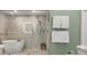 Modern bathroom featuring a glass-enclosed shower, stylish soaking tub, and sophisticated fixtures at 582 Lakeshore Ne Dr, Atlanta, GA 30307