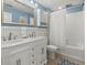 Bright bathroom features a double vanity, tub, shower and tile flooring at 582 Lakeshore Ne Dr, Atlanta, GA 30307