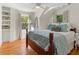 Bright bedroom with hardwood floors and natural light from two windows at 582 Lakeshore Ne Dr, Atlanta, GA 30307