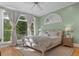 Serene bedroom features soft natural light, a ceiling fan, and neutral tones for a calm ambiance at 582 Lakeshore Ne Dr, Atlanta, GA 30307
