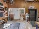 Clean garage space with storage options, a door to the exterior, and room for projects at 582 Lakeshore Ne Dr, Atlanta, GA 30307