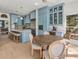 Open kitchen and breakfast nook with blue cabinets, island seating, and views to the outside at 582 Lakeshore Ne Dr, Atlanta, GA 30307