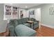 Inviting living room features a plush sofa, wood floors, and built-in bookshelves at 582 Lakeshore Ne Dr, Atlanta, GA 30307