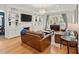Cozy living room with built-in shelving, a large window, and hardwood flooring at 582 Lakeshore Ne Dr, Atlanta, GA 30307