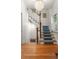 Elegant staircase with a chandelier and hardwood flooring adds a touch of sophistication at 582 Lakeshore Ne Dr, Atlanta, GA 30307