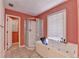 Bathroom featuring a glass shower stall, large soaking tub, and tiled floor at 1464 Yorktown Nw Dr, Lawrenceville, GA 30043