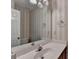 Well-lit bathroom featuring a large mirror over the sink and a toilet at 1464 Yorktown Nw Dr, Lawrenceville, GA 30043