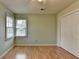 Inviting bedroom with ample natural light, wood floors, and a spacious closet for organized storage at 1464 Yorktown Nw Dr, Lawrenceville, GA 30043