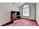 Small bedroom featuring a vaulted window and a built-in study desk at 1464 Yorktown Nw Dr, Lawrenceville, GA 30043