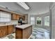 Traditional kitchen with wood cabinets, an island, and a breakfast nook at 1464 Yorktown Nw Dr, Lawrenceville, GA 30043