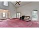 Bright living room with vaulted ceilings, many windows, and a decorative front door at 1464 Yorktown Nw Dr, Lawrenceville, GA 30043