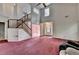 Spacious living room featuring a fireplace, high ceilings, and an open staircase at 1464 Yorktown Nw Dr, Lawrenceville, GA 30043