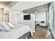 Open-concept bedroom features a view into the living room and a large window at 3300 Windy Ridge Se Pkwy # 718, Atlanta, GA 30339